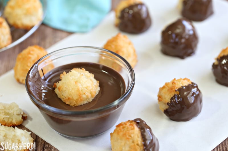 Coconut Macaroons - gluten-free coconut cookies made with just a handful of ingredients! Crispy on the outside, soft and chewy on the inside. | From SugarHero.com Coconut Macaroons - gluten-free coconut cookies dunked in rich semi-sweet chocolate. Crispy on the outside, soft and chewy on the inside. | From SugarHero.com